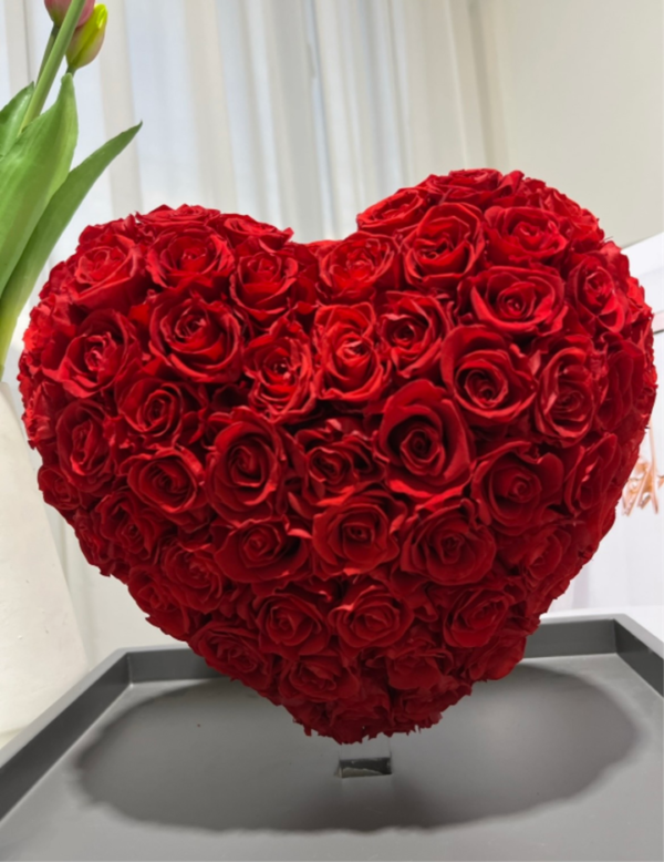 A heart shaped bouquet of roses